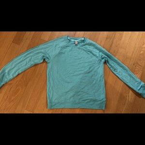 Athlete girl turquoise long sleeve top